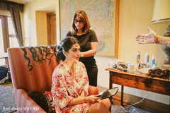 Lovely Indian bride getting her hair done. Lovely Indian bride getting her hair done.