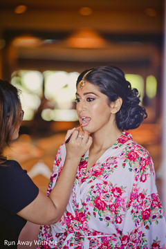 Sweet Indian bride getting ready with her lipstick. Sweet Indian bride getting ready with her lipstick.