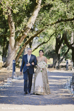 Charming Indian bride with her wedding dress and bouquet. Charming Indian bride with her wedding dress and bouquet.