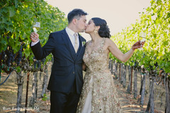 Kiss capture of Indian bride and groom at their outdoor photo shoot. Kiss capture of Indian bride and groom at their outdoor photo shoot.