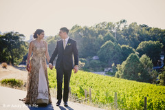 Adorable Indian couple walking holding hands. Adorable Indian couple walking holding hands.