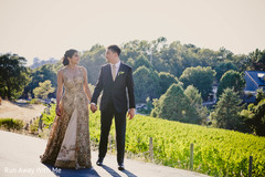 Joyful Indian bride and groom holding hands capture. Joyful Indian bride and groom holding hands capture.