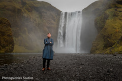Gorgeous Indian husband by the Skogafoss Waterfall in Iceland. Gorgeous Indian husband by the Skogafoss Waterfall in Iceland.