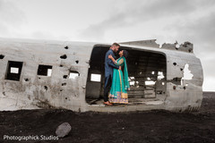 Romantic scene of Indian husband and wife at the Solheimasandur Plane Crash in Iceland. Romantic scene of Indian husband and wife at the Solheimasandur Plane Crash in Iceland.