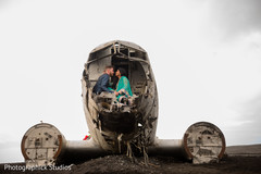 Indian couple seated at the front of the Solheimasandur Plane Crash in Iceland. Indian couple seated at the front of the Solheimasandur Plane Crash in Iceland.