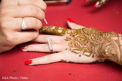 Henna artist making mehndi art Henna artist making mehndi art