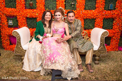 Lovely indian bride posing with parents Lovely indian bride posing with parents