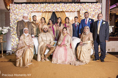 Enchanting Indian bride and groom's family capture at the wedding reception. Enchanting Indian bride and groom's family capture at the wedding reception.