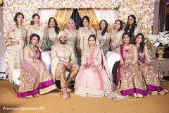 Marvelous Indian lovebirds portrait with bridesmaids at the wedding reception. Marvelous Indian lovebirds portrait with bridesmaids at the wedding reception.