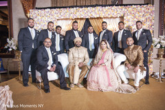 Indian wedding portrait of bride, groom and groomsmen. Indian wedding portrait of bride, groom and groomsmen.