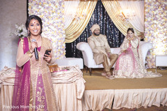 Gorgeous Indian bridesmaid giving out a speech at the wedding reception. Gorgeous Indian bridesmaid giving out a speech at the wedding reception.