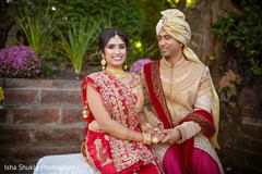 Charming Indian bride and groom holding hands. Charming Indian bride and groom holding hands.