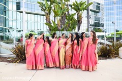 Glamorous indian bride posing with bridesmaids Glamorous indian bride posing with bridesmaids