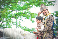 Elegant Indian groom riding baraat white horse. Elegant Indian groom riding baraat white horse.