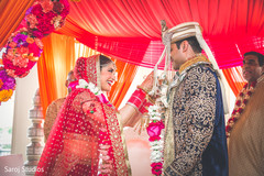 Indian bride and groom exchanging garlands ceremony. Indian bride and groom exchanging garlands ceremony.