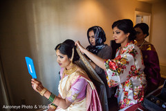 Indian bride getting her Ghoonghat put on capture. Indian bride getting her Ghoonghat put on capture.