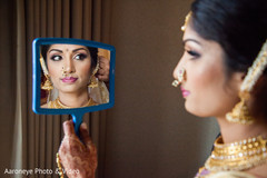 Gorgeous bride getting her Ghoonghat put on. Gorgeous bride get Gorgeous bride getting her Ghoonghat put on. Gorgeous bride get