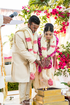 The ritual where bride and groom throw the rice on to sacred fire. The ritual where bride and groom throw the rice on to sacred fire.