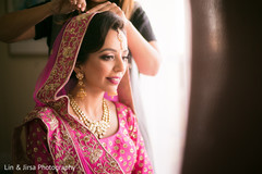 Indian bride getting her Ghoonghat put on. Indian bride getting her Ghoonghat put on.