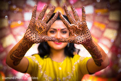 Indian bride showing mehndi art Indian bride showing mehndi art