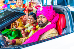 Indian bride and groom inside wedding car Indian bride and groom inside wedding car