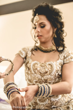 Marvelous capture of Indian bride getting her bangles on. Marvelous capture of Indian bride getting her bangles on.