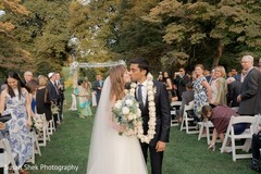 Indian newlyweds leaving wedding ceremony indian wedding ceremony,indian wedding ceremony photography,indian bride and groom