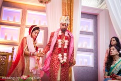 Indian bride and groom walking the seven steps ritual. Indian bride and groom walking the seven steps ritual.