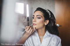 Lovely bride getting her makeup done indian wedding gallery,indian bride getting ready,indian bride makeup