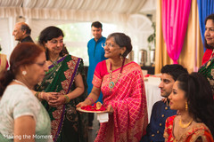 Lovely Indian family portrait taken with bride and groom. Lovely Indian family portrait taken with bride and groom.