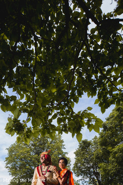 Adorable Indian bride and groom out door portrait. Adorable Indian bride and groom out door portrait.