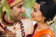 Romantic Indian bride and groom looking at each other. indian bride and groom,indian wedding fashion,indian bride's jewelry