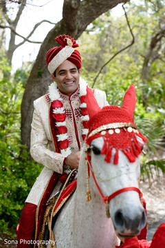 Elegant Indian groom riding baraat white horse. Elegant Indian groom riding baraat white horse.