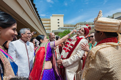 Indian groom at the entrance of wedding ceremony for a baraat ritual. Indian groom at the entrance of wedding ceremony for a baraat ritual.