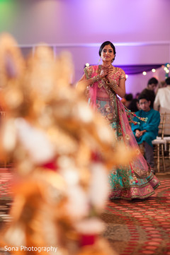 Indian bride dancing at her sangeet celebration. Indian bride dancing at her sangeet celebration.