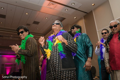 Indian guests dancing at the pre-wedding sangeet celebration. Indian guests dancing at the pre-wedding sangeet celebration.