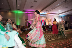 Indian bride doing a performance for groom at sangeet party. Indian bride doing a performance for groom at sangeet party.