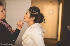 Lovely bride getting her makeup done Lovely bride getting her makeup done