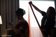 Indian bride getting her Ghoonghat on. Indian bride getting her Ghoonghat on.