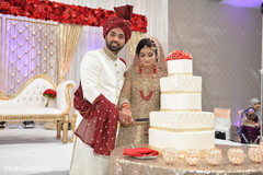 Indian wedding cutting the cake scene. Indian wedding cutting the cake scene.