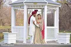 Joyful Indian bride and groom holding capture. Joyful Indian bride and groom holding capture.
