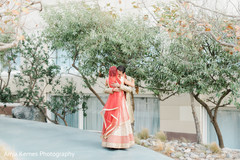 Indian bride and groom's romantic first look moment. Indian bride and groom's romantic first look moment.