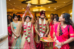 Indian bride throws rice behind her Indian bride throws rice behind her