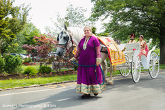 Lovely capture of indian bride and groom on their wedding carriage Lovely capture of indian bride and groom on their wedding carriage