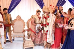 When bride and groom are tied during the wedding ceremony and she walks behind groom. When bride and groom are tied during the wedding ceremony and she walks behind groom.