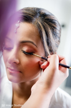 Beautiful indian bride being dolled up for her ceremony Beautiful indian bride being dolled up for her ceremony