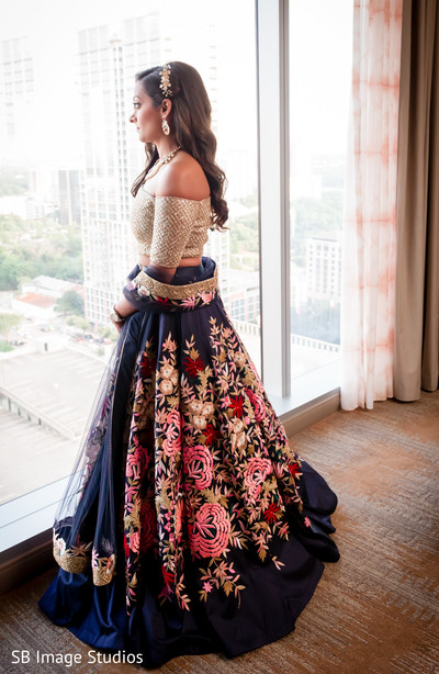 Beautiful indian bride looking out the window