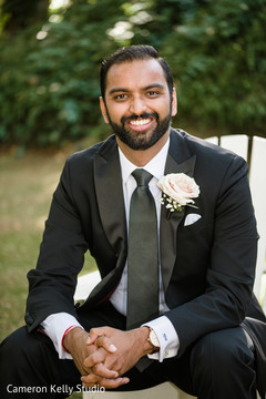 Indian groom posing with his wedding outfit. Indian groom posing with his wedding outfit.