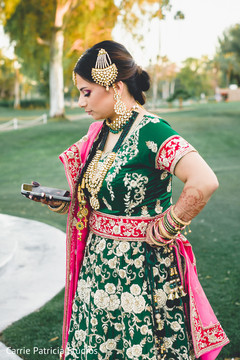 Gorgeous Indian bride in a golden and green sangeet outfit. Gorgeous Indian bride in a golden and green sangeet outfit.