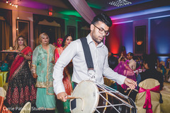 Indian Dhol player capture at the sangeet party. Indian Dhol player capture at the sangeet party.